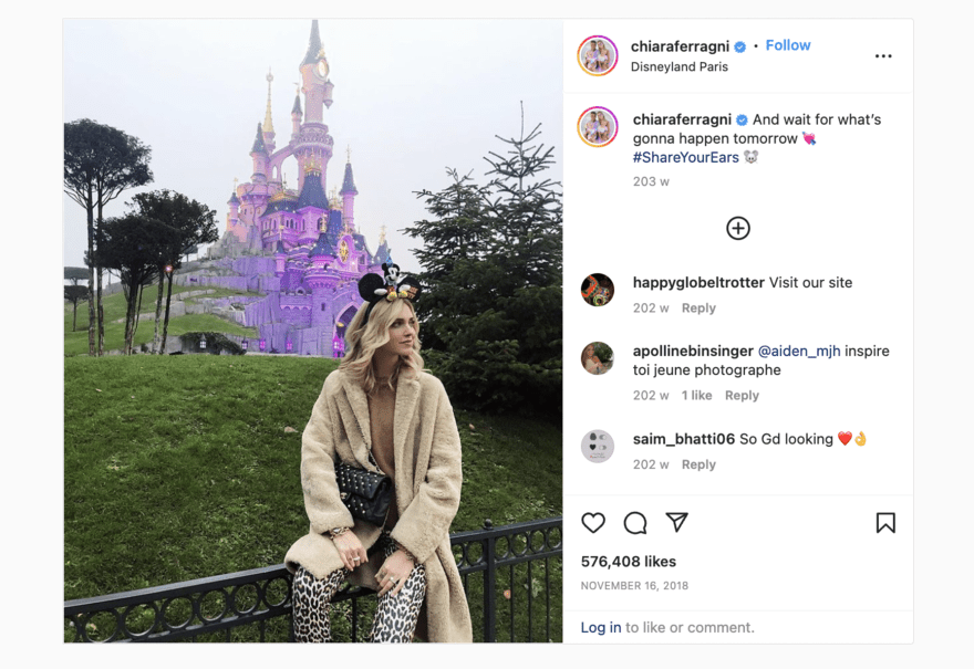 Instagram post of a woman sitting in front of the Disneyland castle, taking part in Disney's #ShareYourEars campaign.